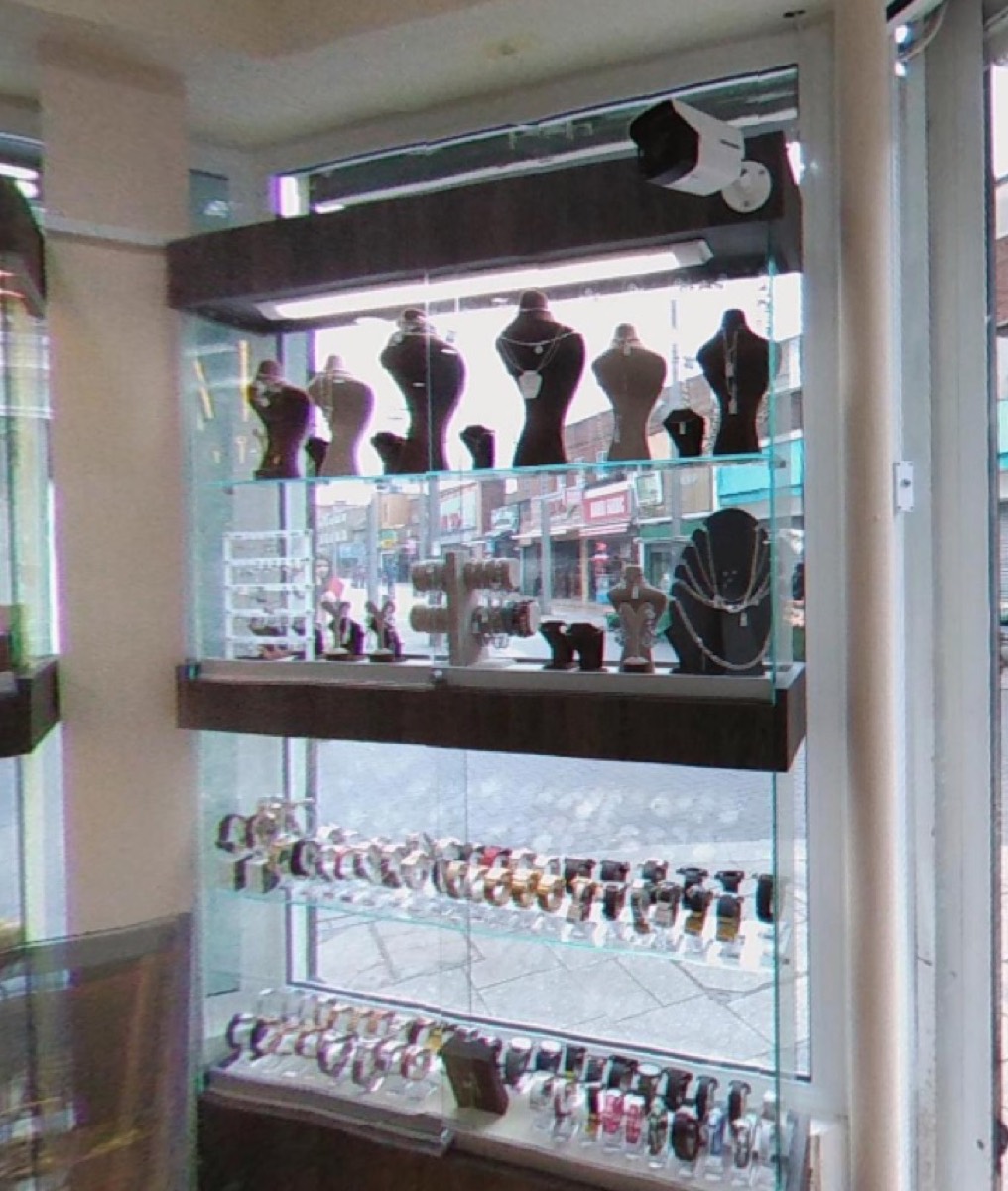 Wall of watches and necklace displays in the Italgold London cabinet